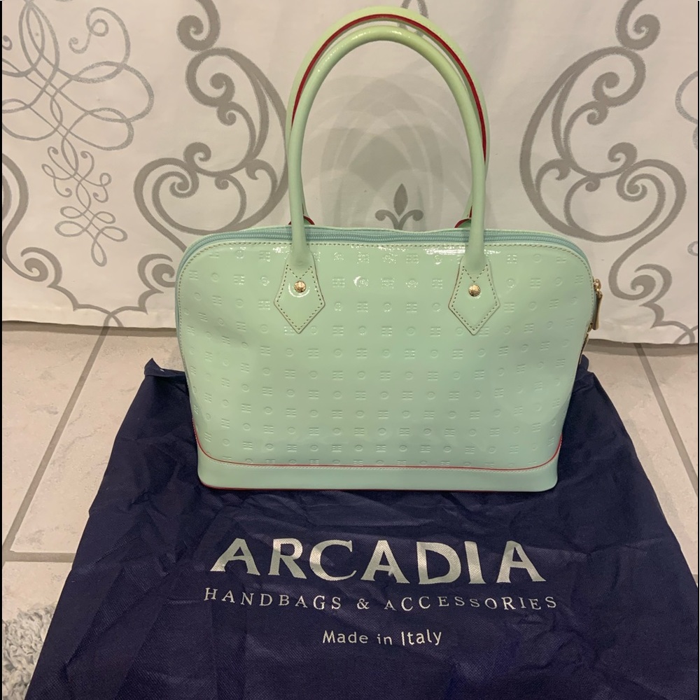 Patent leather dome style handbag